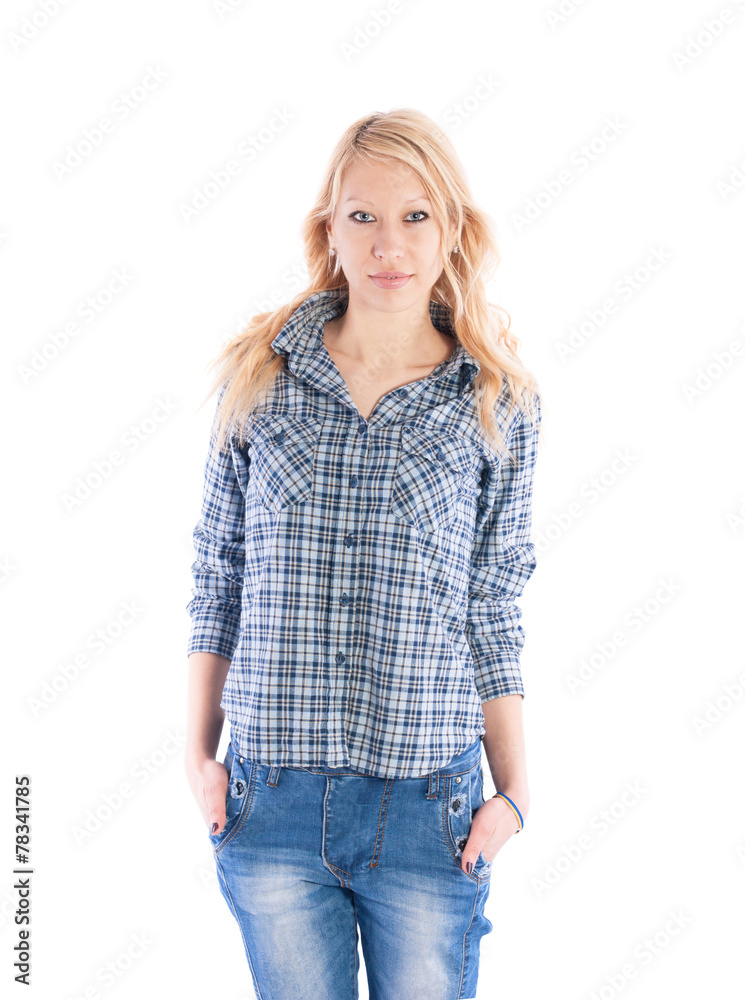 Beautiful girl in a plaid shirt and jeans on white background. Beautiful girl in a plaid shirt and jeans on white background.