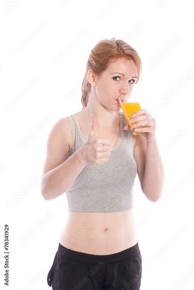 Athletic girl with a glass of juice and a thumbs up Athletic girl with a glass of juice and a thumbs up