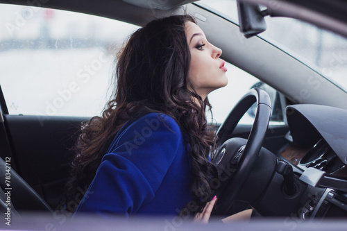 woman trying to drive around an obstacle on the road