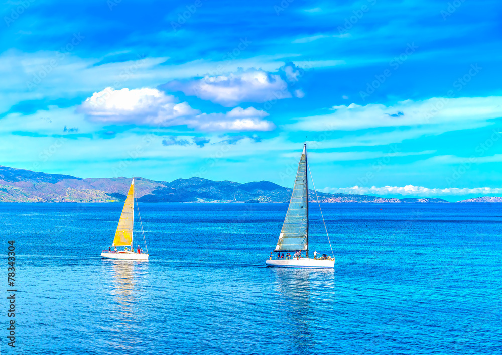 Obraz premium sailing boats out of the port of Hydra island in Greece. HDR