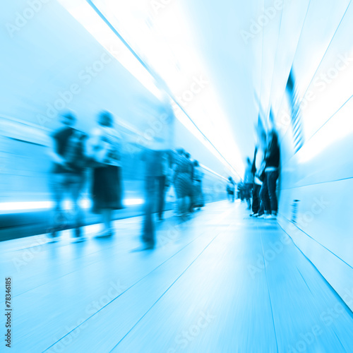 Blurred people in subway station.