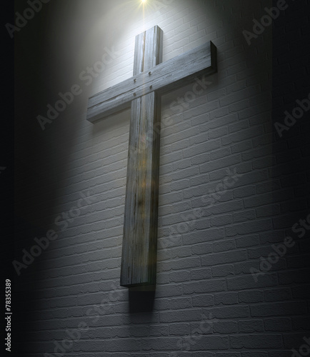 Crucifix On A Wall Under Spotlight photo
