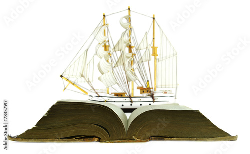 Sailing ship and open book with blue pages