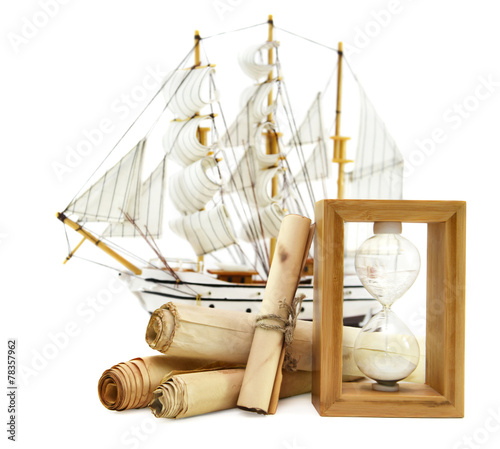 Ship with paper scrolls and hourglass photo