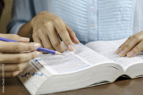 image of two women discussing assignment