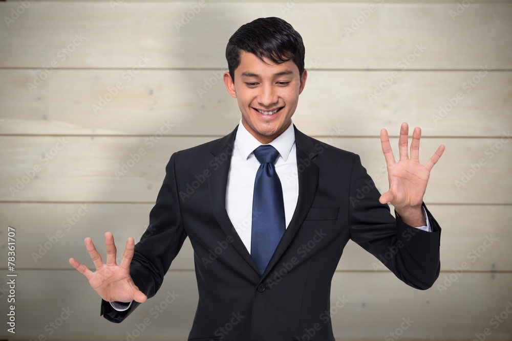 Composite image of smiling businessman touching Composite image of smiling businessman touching