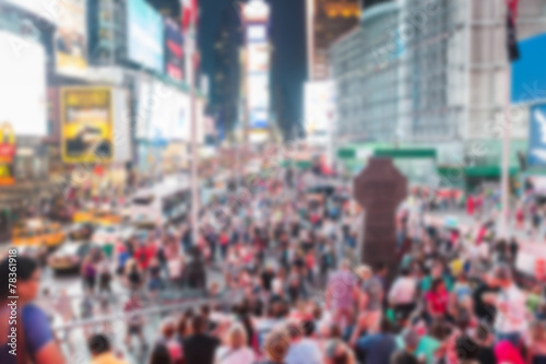 Times Square crowded of tourists at night. Blurred Background.