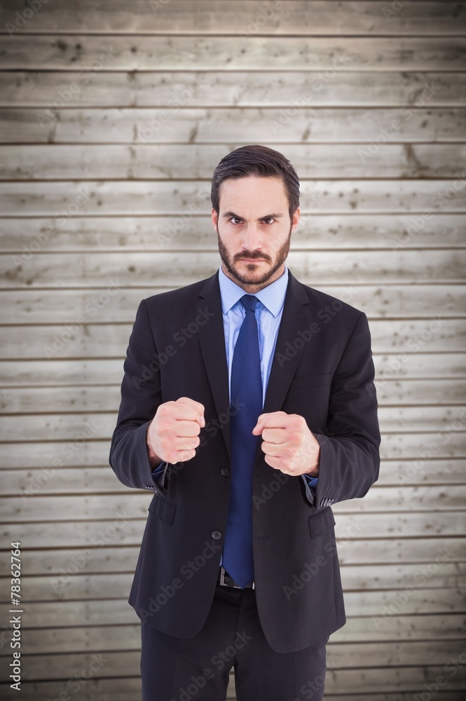 Angry businessman with closed fists looking at camera Angry businessman with closed fists looking at camera