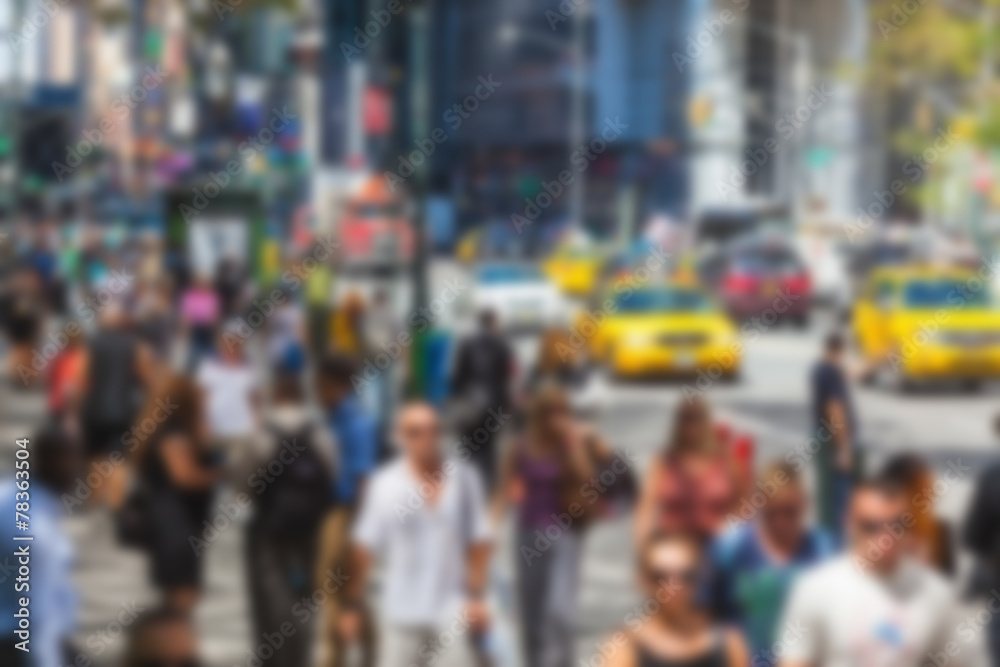 Crowded 5th Avenue with tourists and taxi. Blurred Background. Crowded 5th Avenue with tourists and taxi. Blurred Background.