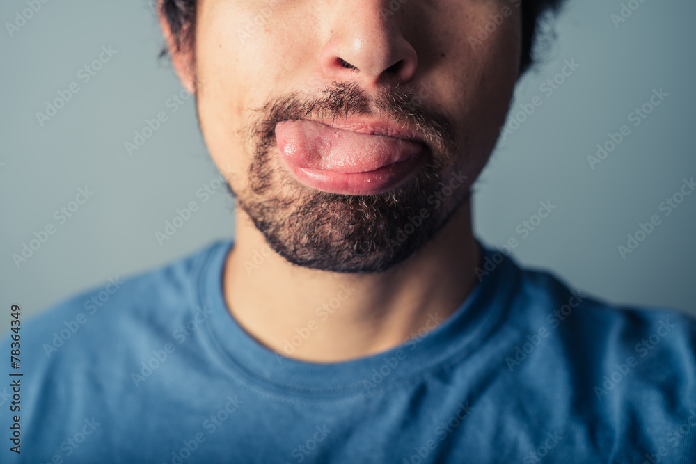 Fototapeta premium Young man pulling faces