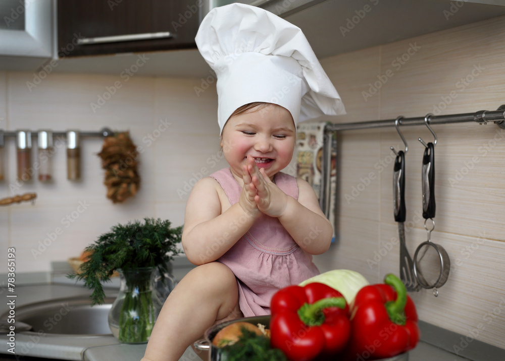 Smiling baby looking at vegetables Smiling baby looking at vegetables