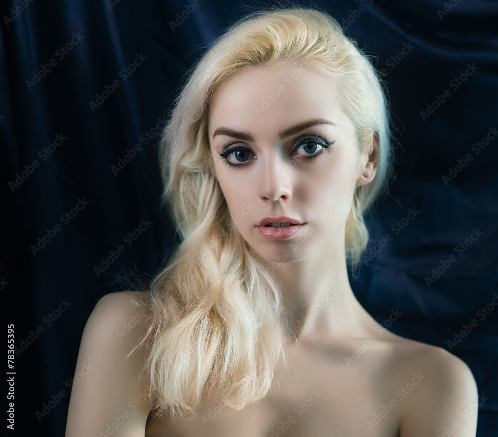 Portrait of beautiful young blond woman. Soft focus on eyes.