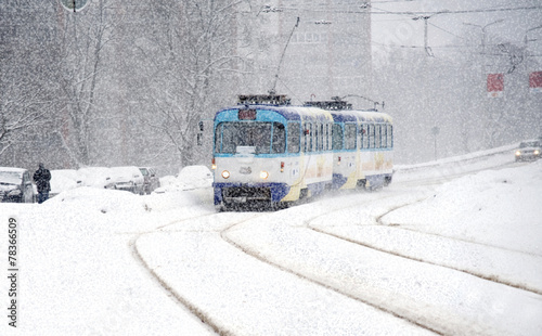 Winter. Movement of the tram during snowfall.
