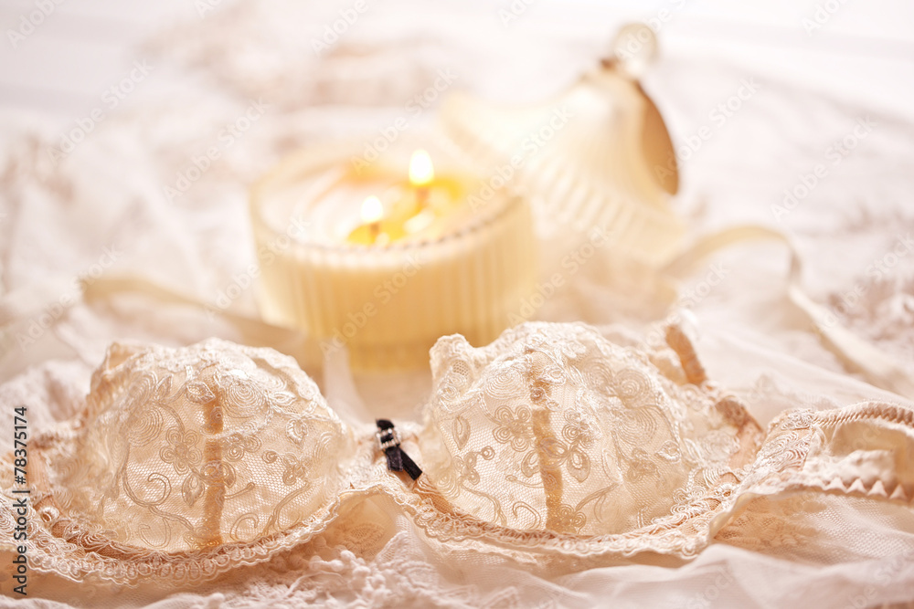 Tenderness peachys lingerie with candle and motif. Love mood.