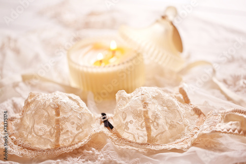 Obraz na płótnie Tenderness peachys lingerie with candle and motif. Love mood. w salonie