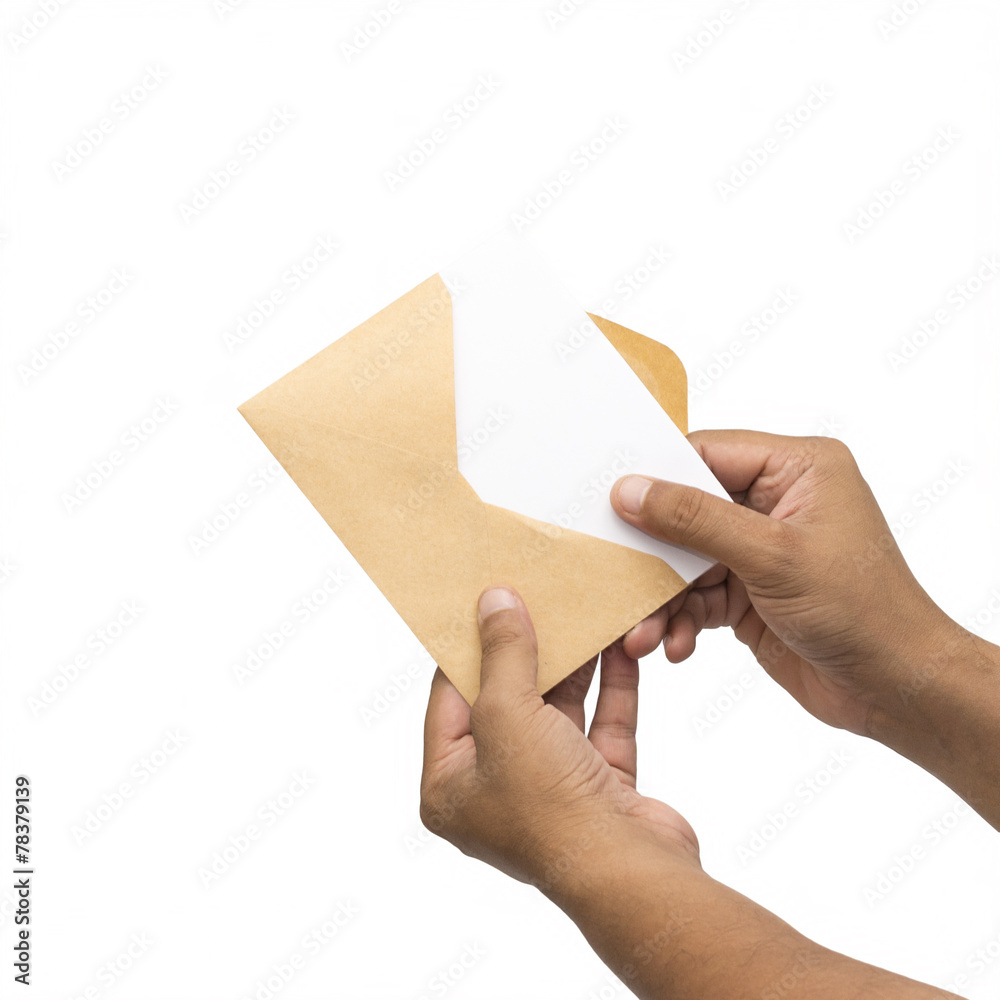 Male hand holding blank envelope with a card.