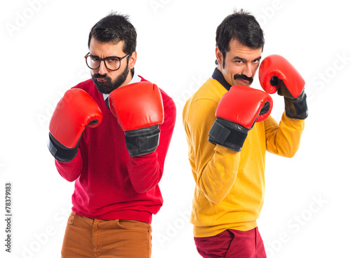 Twin brothers with boxing gloves