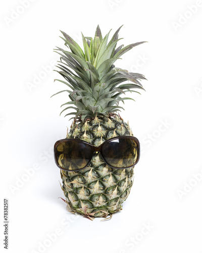Pineapple wearing sunglasses isolated with white background