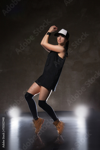 Sexy young woman in a trendy clothes over black background