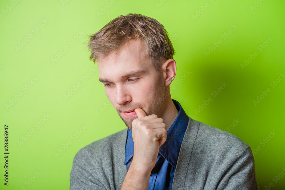Closeup portrait of thinking man with finger in mouth, sucking thumb, biting fingernail in anxiety, stress, deep in thought. Negative emotion, facial expression, feelings Closeup portrait of thinking man with finger in mouth, sucking thumb, biting fingernail in anxiety, stress, deep in thought. Negative emotion, facial expression, feelings