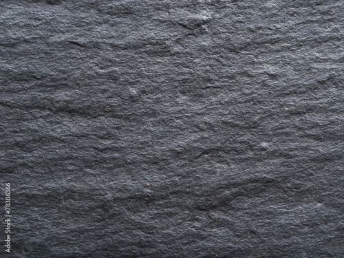 Rough graphite background. Closeup shot.