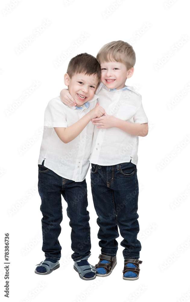 twins, one embraces another, isolated on the white twins, one embraces another, isolated on the white