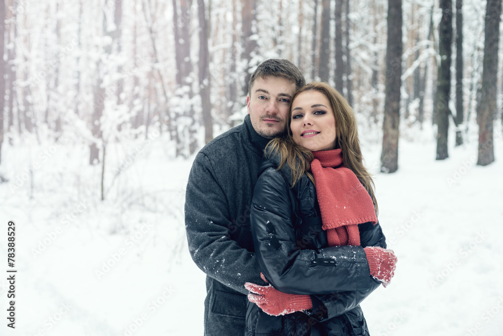 Portrait of happy couple in winter park Portrait of happy couple in winter park
