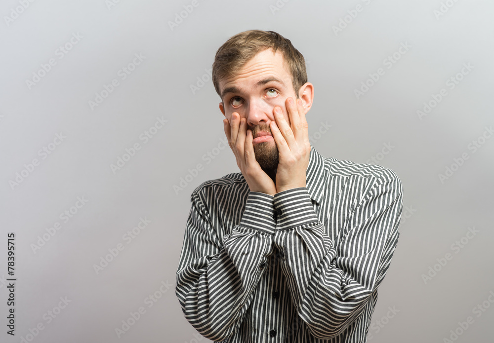 Closeup portrait, headshot young tired, fatigued business man hand