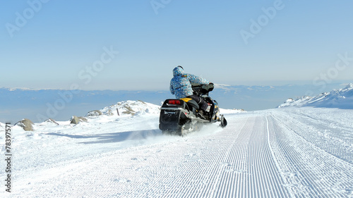 Single Man On A Snowmobile