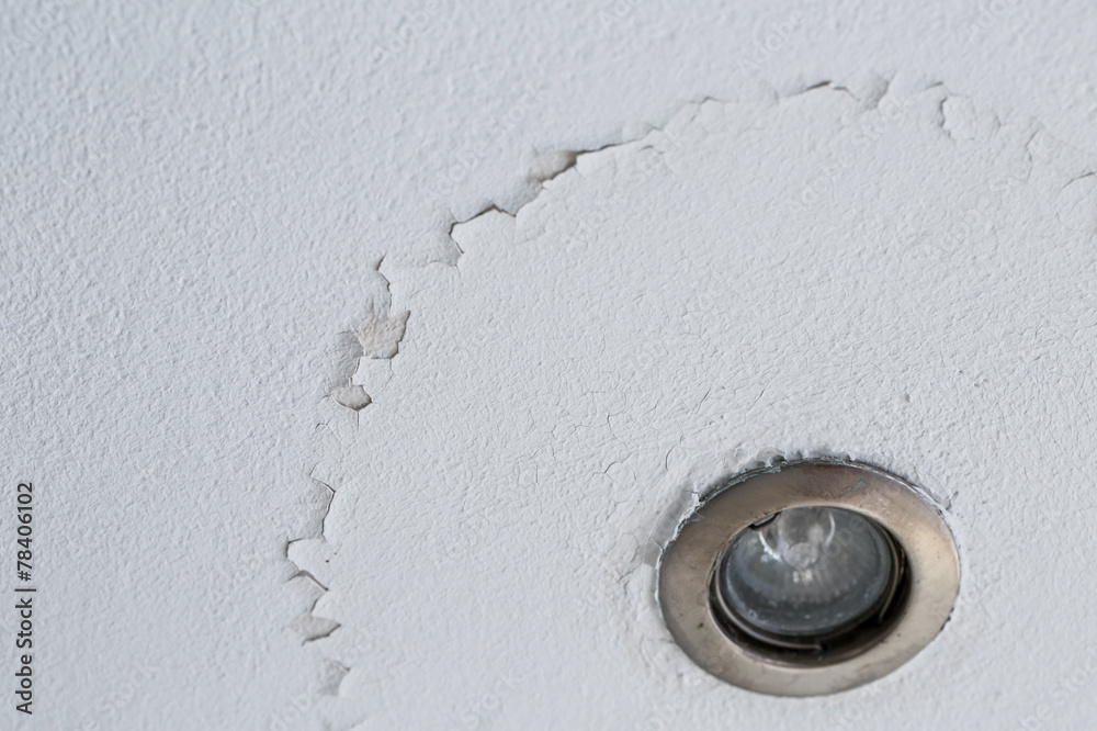 Cracked peeling layer on ceiling