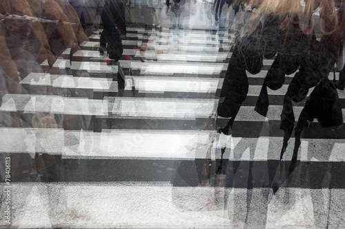 People crossing a road, blurred, in motion