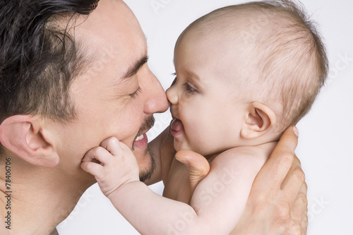 Father and baby daughter sharing a moment