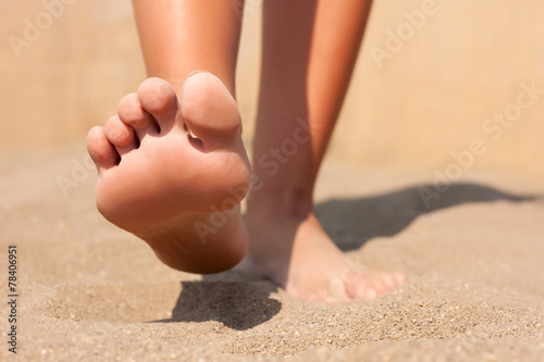 Closeup feet on beach summer