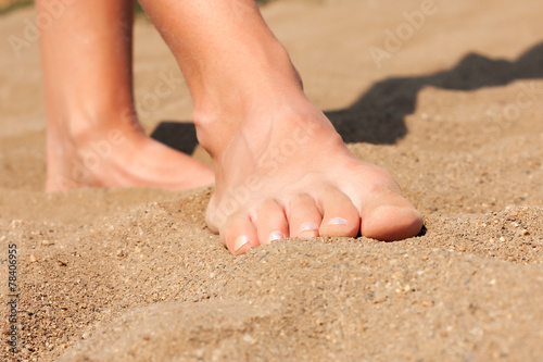 Feet on sand © koszivu