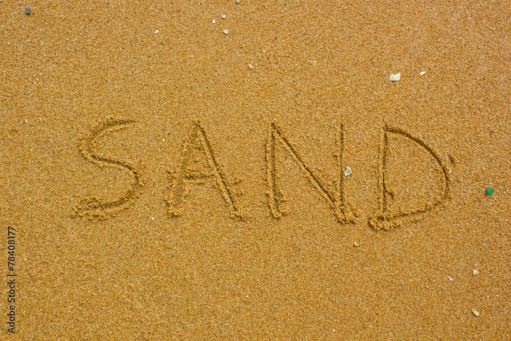 Fototapeta premium Sand handwritten on the beach