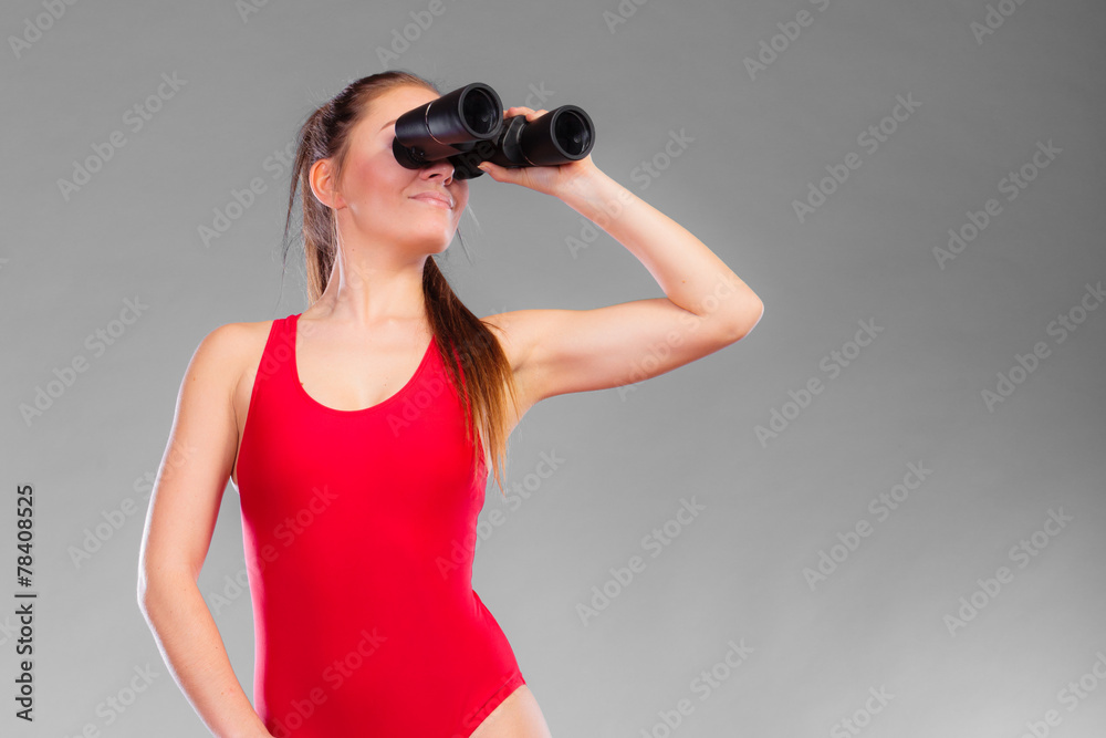 lifeguard on duty looking through binocular lifeguard on duty looking through binocular