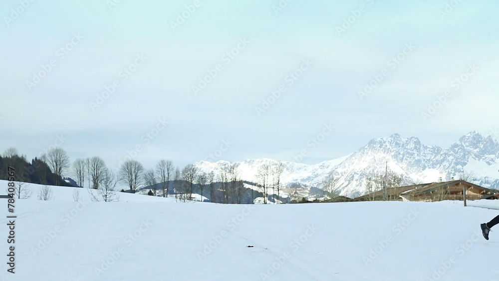 Woman running in cross country road on winter Woman running in cross country road on winter