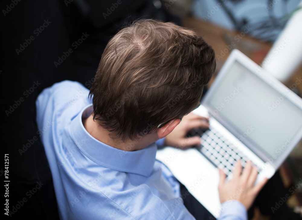 Handsome business man working with computer. Handsome business man working with computer.