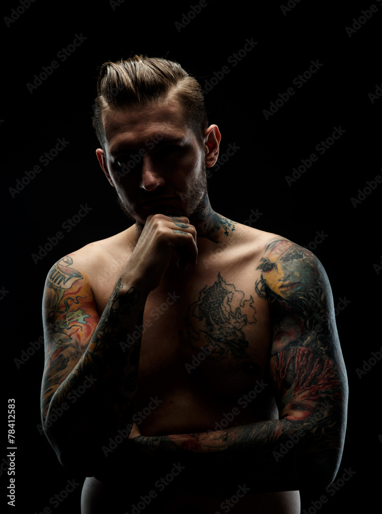 Portrait of a manwith tattooes.
