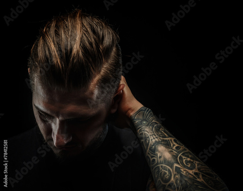 Portrait of a manwith tattooes.