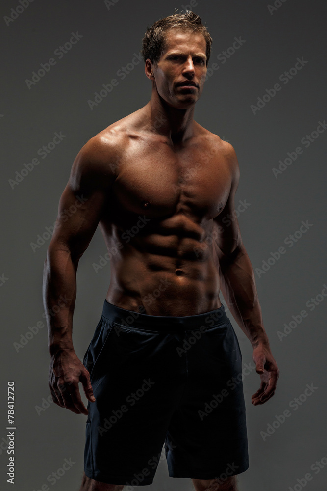 Fototapeta premium Muscular female in black shorts.