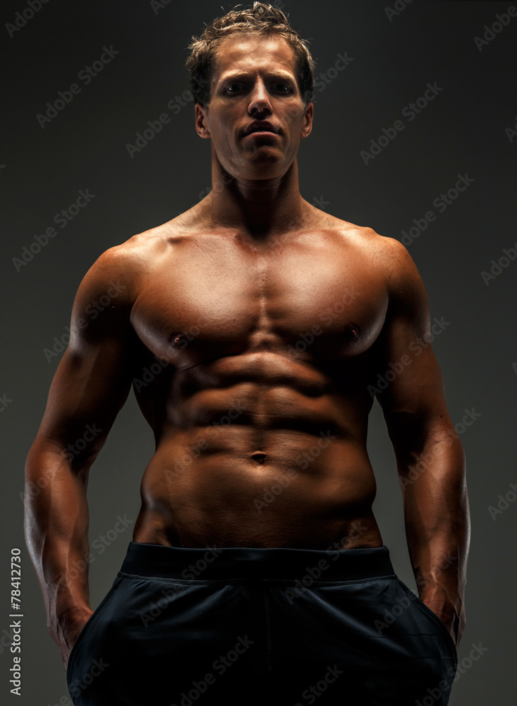 Fototapeta premium Muscular female in black shorts.