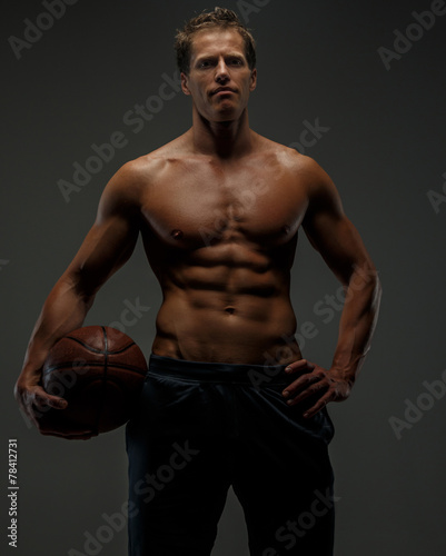 Muscular female with basket ball.
