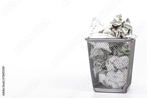 isolated wastebasket full of white waste newspaper