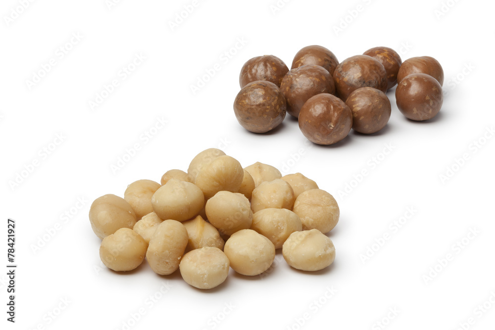 Peeled and unpeeled macadamia nuts Peeled and unpeeled macadamia nuts