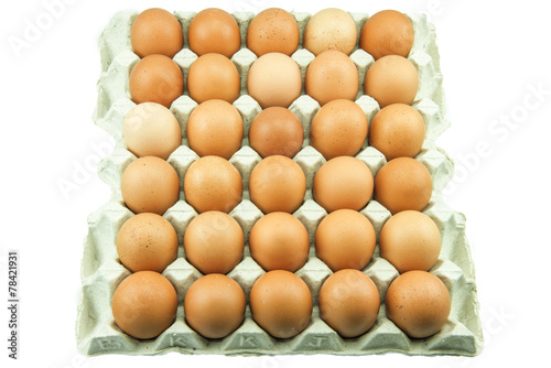 Eggs in paper tray isolated on white Background.