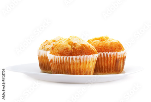 Cupcakes on a plate, isolated on white