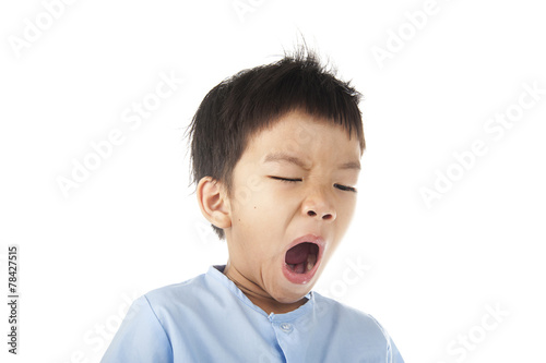 Boy yawn after woke up in the morning