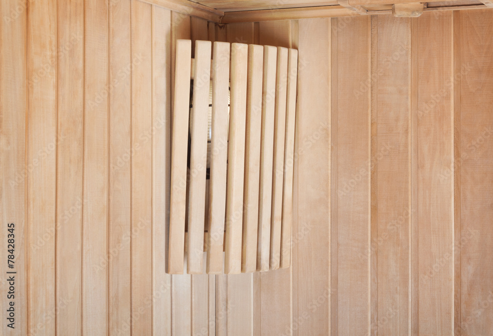 Bright lamp on the wall of traditional wooden sauna Bright lamp on the wall of traditional wooden sauna
