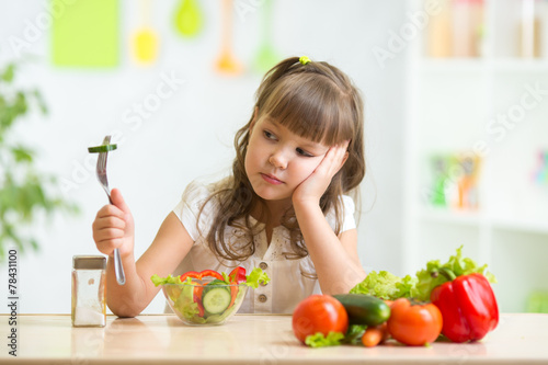 Child looks with disgust for food.